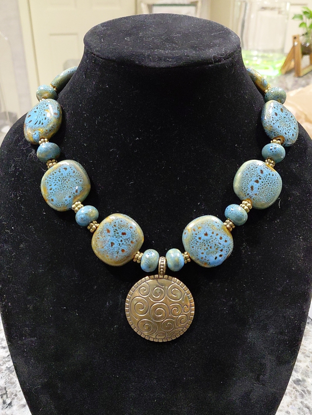 Blue and Gold Bead Necklace with Bronze  Pendant w/ Toggle Clasp. 20in Long
